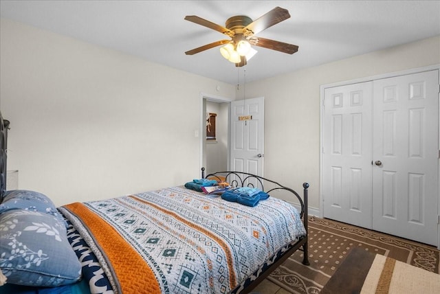 bedroom featuring ceiling fan and a closet