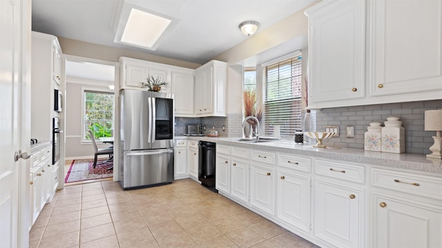 kitchen with smart refrigerator, black dishwasher, a sink, white cabinets, and decorative backsplash