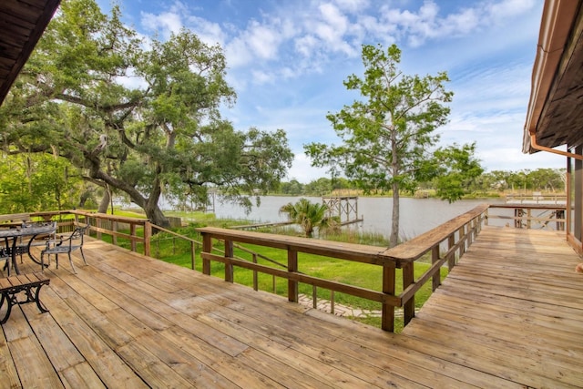 6348 County Road 659, Brazoria, TX 77422 - deck with outdoor dining space and a water view
