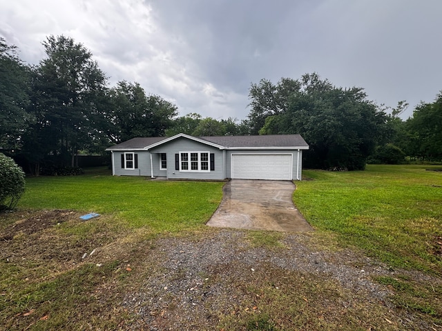 ranch-style home with driveway, a front yard, and a garage