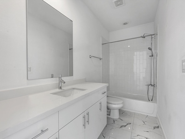 bathroom with visible vents, vanity, baseboards, toilet, and marble finish floor