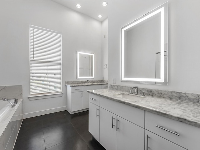bathroom featuring a sink, baseboards, recessed lighting, and two vanities