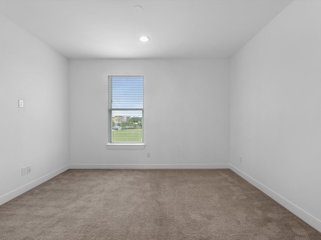 carpeted empty room with recessed lighting and baseboards