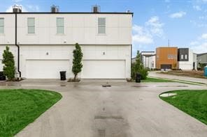 exterior space with driveway and a garage