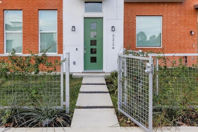 property entrance with brick siding