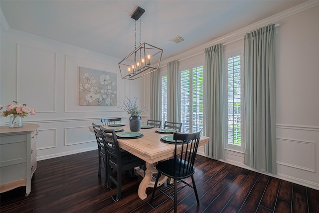 1307 Romero Dr, Pearland, TX 77581 - dining space featuring a decorative wall, visible vents, crown molding, dark wood-style floors, and a notable chandelier