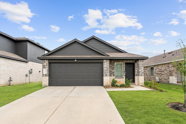 view of front of property with concrete driveway, an attached garage, stone siding, and a front lawn