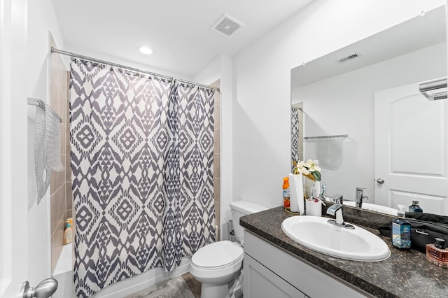 bathroom featuring vanity, shower / bath combination with curtain, toilet, and visible vents