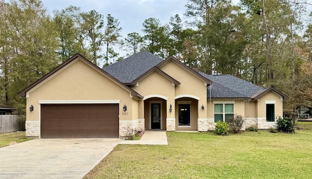 view of front of house with a garage, driveway, stone siding, and stucco siding