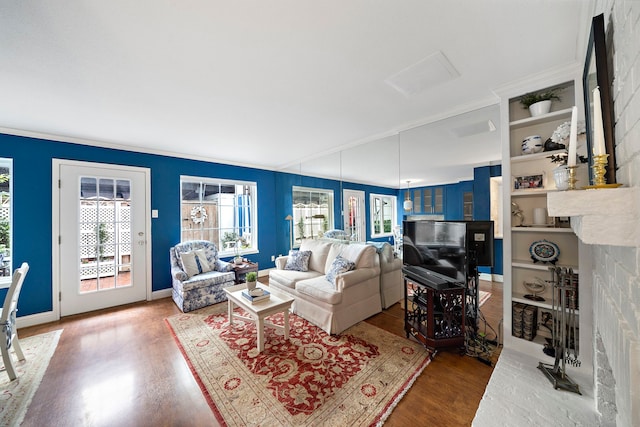 8944 Chatsworth Dr, Houston, TX 77024 - living room featuring ornamental molding and wood finished floors