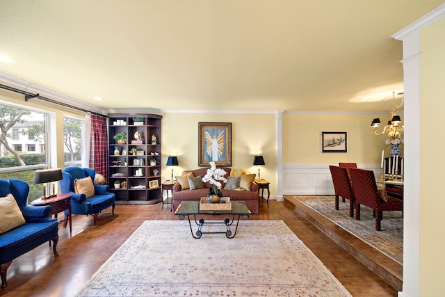 8944 Chatsworth Dr, Houston, TX 77024 - living area with ornamental molding, wainscoting, wood finished floors, and a chandelier