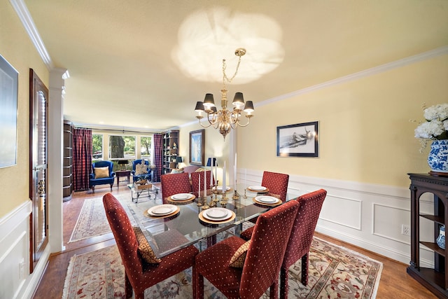 8944 Chatsworth Dr, Houston, TX 77024 - dining room featuring ornamental molding, wainscoting, a decorative wall, wood finished floors, and a notable chandelier