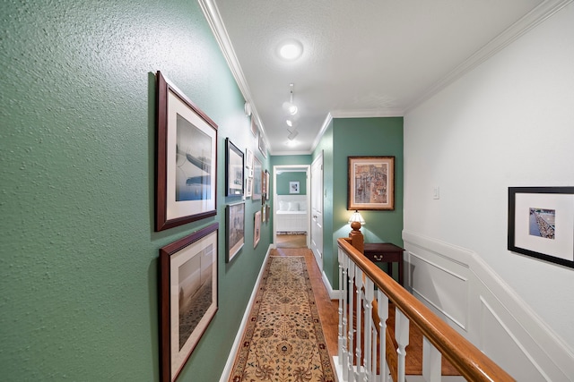 8944 Chatsworth Dr, Houston, TX 77024 - hallway with ornamental molding, wainscoting, and an upstairs landing