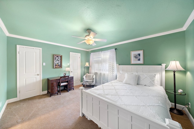 8944 Chatsworth Dr, Houston, TX 77024 - bedroom with crown molding, light carpet, a textured ceiling, a ceiling fan, and baseboards