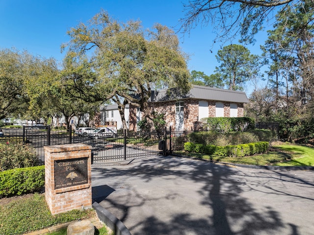 8944 Chatsworth Dr, Houston, TX 77024 - view of road with a gate and curbs