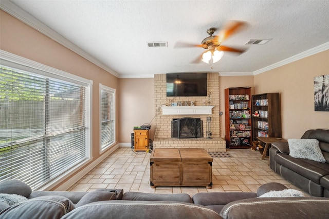 living area featuring visible vents, a ceiling fan, and crown molding