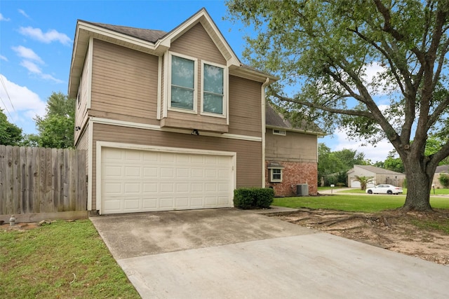 view of front of home with fence, a front lawn, a garage, central air condition unit, and driveway
