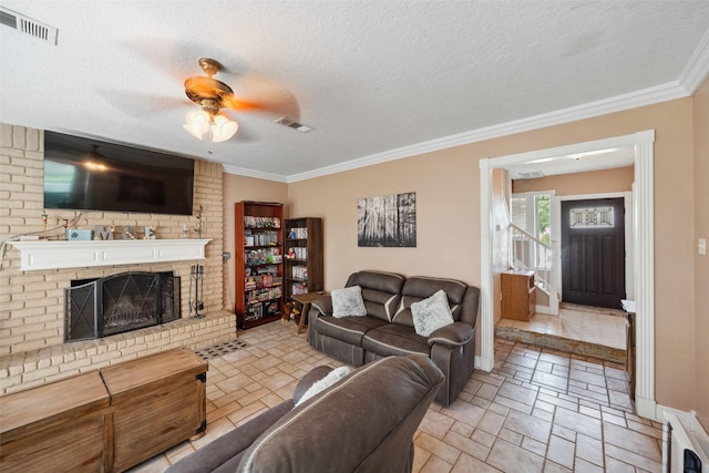 living room with visible vents, stone tile floors, baseboards, and ceiling fan