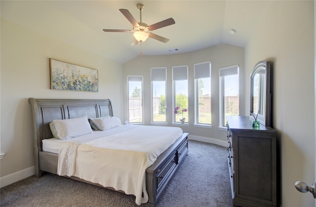 carpeted bedroom featuring visible vents, a ceiling fan, baseboards, and vaulted ceiling