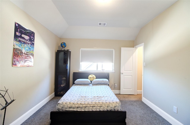bedroom featuring baseboards, visible vents, vaulted ceiling, and carpet