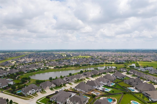 drone / aerial view with a water view and a residential view