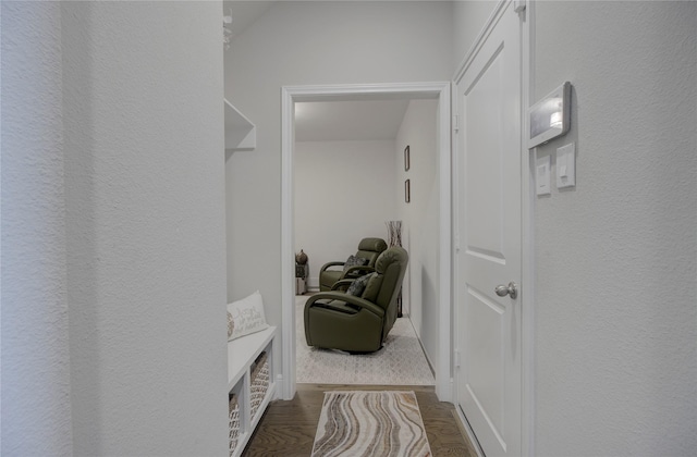 hall with wood finished floors