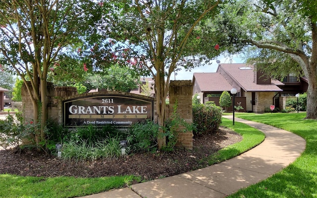 2611 Grants Lake Blvd Unit 228, Sugar Land, TX 77479 - community sign featuring a lawn