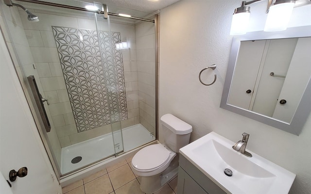 2611 Grants Lake Blvd Unit 228, Sugar Land, TX 77479 - full bathroom featuring toilet, a stall shower, vanity, and tile patterned floors