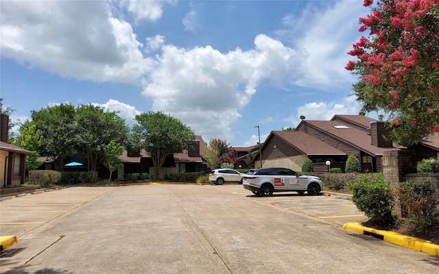 2611 Grants Lake Blvd Unit 228, Sugar Land, TX 77479 - view of street with curbs and a residential view