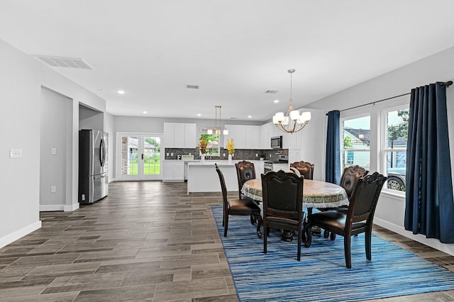 3409 2nd Ave N, Texas City, TX 77590 - dining area with baseboards, visible vents, recessed lighting, and a chandelier