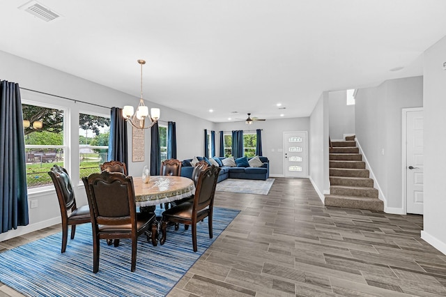 3409 2nd Ave N, Texas City, TX 77590 - dining room with baseboards, visible vents, wood finished floors, and stairway