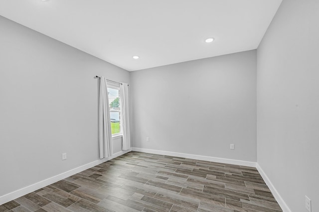 3409 2nd Ave N, Texas City, TX 77590 - empty room with baseboards, recessed lighting, and wood finished floors