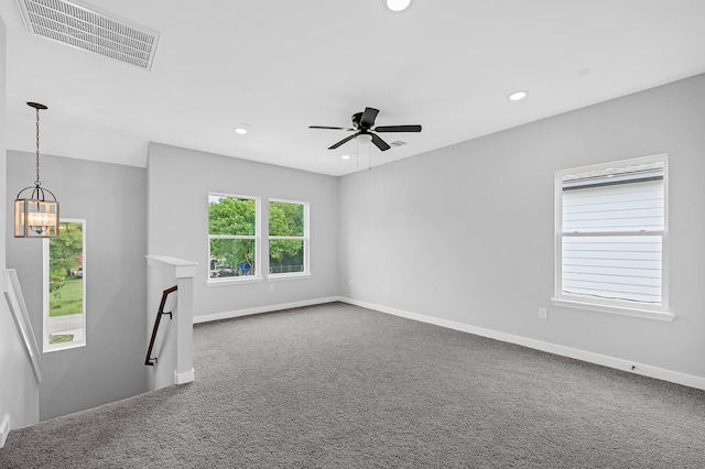 3409 2nd Ave N, Texas City, TX 77590 - unfurnished living room featuring ceiling fan with notable chandelier, carpet flooring, recessed lighting, and visible vents