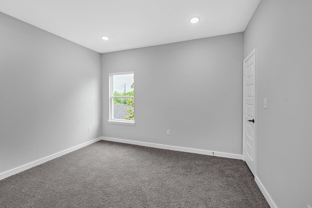 3409 2nd Ave N, Texas City, TX 77590 - unfurnished room with dark carpet, recessed lighting, and baseboards