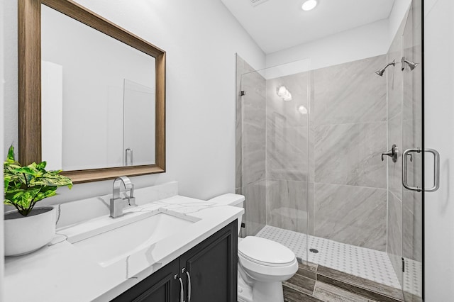 3409 2nd Ave N, Texas City, TX 77590 - bathroom featuring recessed lighting, vanity, a shower stall, and toilet
