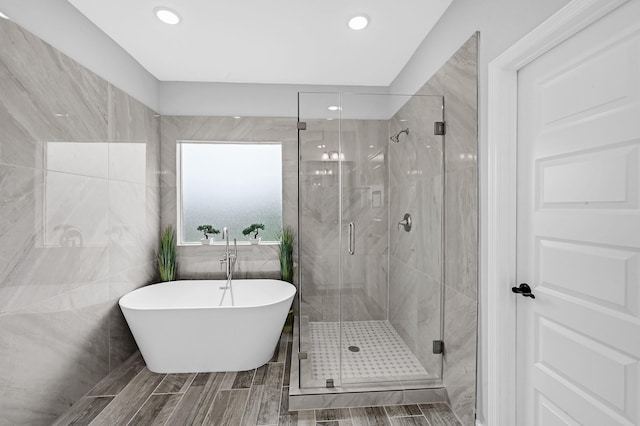 3409 2nd Ave N, Texas City, TX 77590 - bathroom with a freestanding bath, a stall shower, and recessed lighting