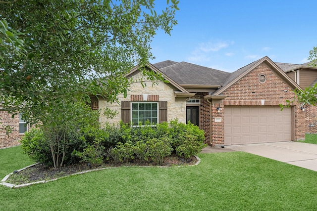 ranch-style home featuring an attached garage, brick siding, a front yard, and concrete driveway