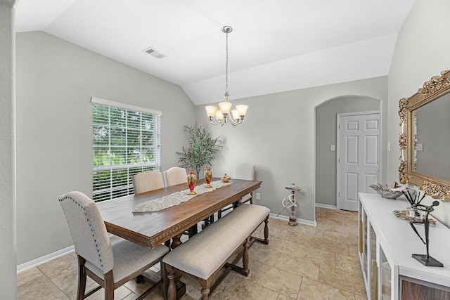 dining room with visible vents, arched walkways, vaulted ceiling, baseboards, and a chandelier