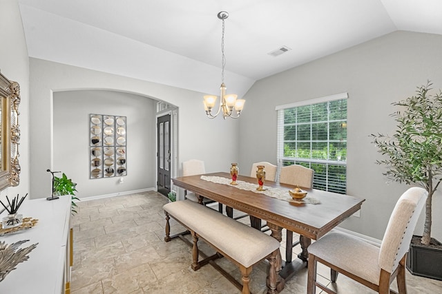 dining area with an inviting chandelier, visible vents, lofted ceiling, baseboards, and arched walkways