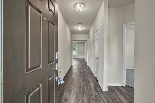 4202 Amber Ruse Dr, Conroe, TX 77304 - hall with dark wood-style flooring, baseboards, and visible vents