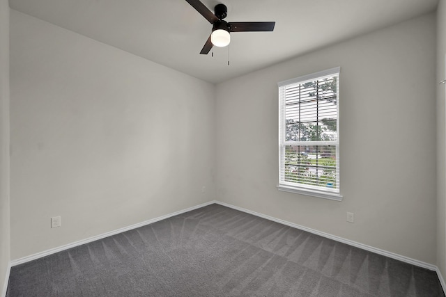 4202 Amber Ruse Dr, Conroe, TX 77304 - unfurnished room featuring baseboards, a ceiling fan, and dark carpet