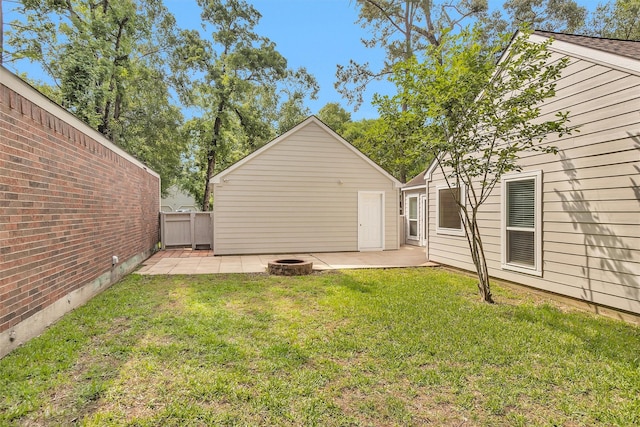 91 Bitterwood Cir, The Woodlands, TX 77381 - view of yard featuring a patio, fence, and an outdoor fire pit