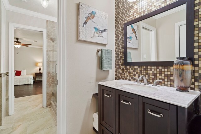 28710 Sapphire Cir, Magnolia, TX 77355 - bathroom with crown molding, vanity, ensuite bath, ceiling fan, and tasteful backsplash
