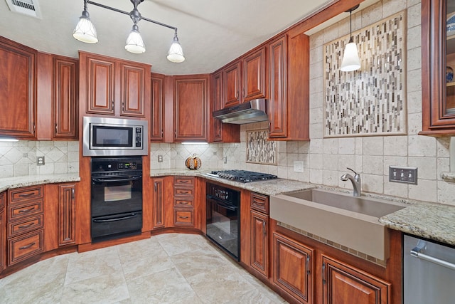 28710 Sapphire Cir, Magnolia, TX 77355 - kitchen with stainless steel appliances, a warming drawer, a sink, decorative backsplash, and under cabinet range hood
