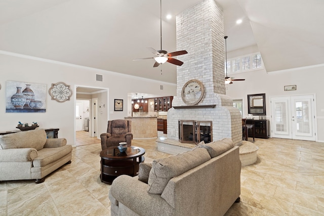28710 Sapphire Cir, Magnolia, TX 77355 - living room with a ceiling fan, high vaulted ceiling, crown molding, a brick fireplace, and baseboards