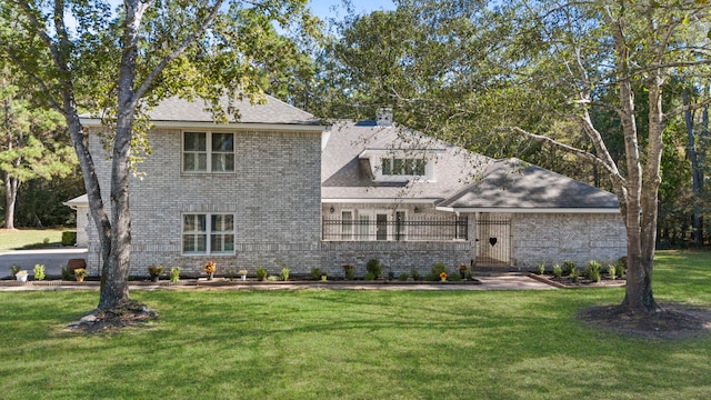 28710 Sapphire Cir, Magnolia, TX 77355 - view of front of home with a front yard and a chimney