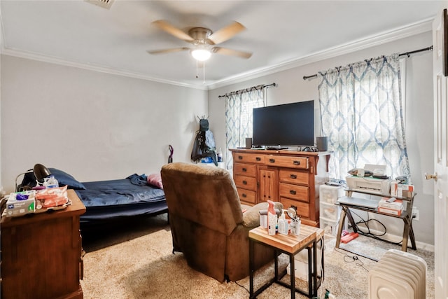bedroom featuring crown molding, ceiling fan, and visible vents