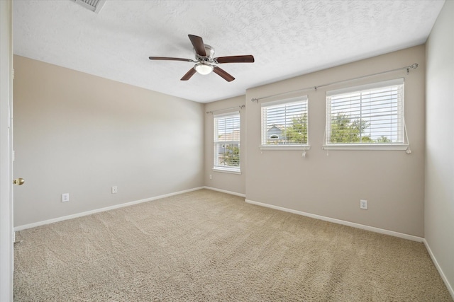 2411 Lacyberry St, Houston, TX 77080 - unfurnished room featuring a ceiling fan, carpet, baseboards, and a textured ceiling