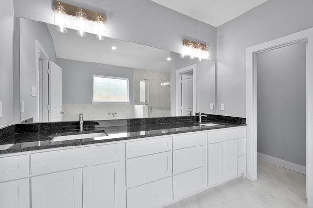 12390 Green Ridge Dr, Willis, TX 77318 - full bathroom with a sink, a shower stall, and double vanity