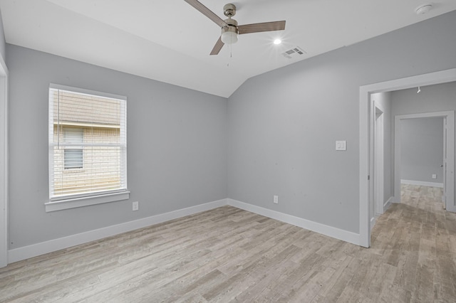 12390 Green Ridge Dr, Willis, TX 77318 - empty room with a healthy amount of sunlight, a ceiling fan, light wood-type flooring, and visible vents